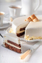 Sweet white chocolate cake with gold chocolate and glaze.