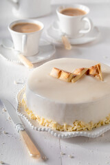 Luxury white chocolate cake with gold chocolate and glaze.