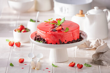 Tasty strawberry cake with red glaze and whipped cream. - obrazy, fototapety, plakaty