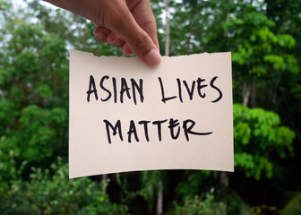 The word hate speech stands on paper speech, Asian hate, political correctness, racism, defamation