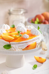 Homemade peach meringue made of fresh fruits.