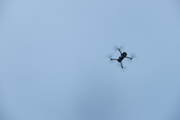 a mini drone flying in the sky