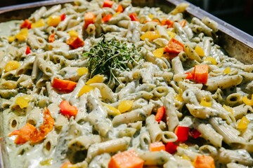 Pasta with cream and scattered vegetables