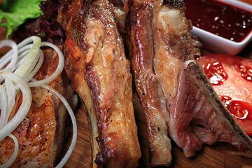 Grilled Lamb ribs on a wooden board, Shallow depth of field