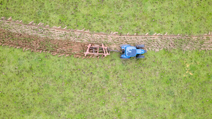 tractor preparing the land for planting. ON a farm in Brazil.