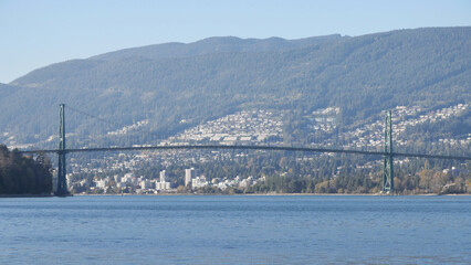Beautiful panoramic view of the Lions Gate Bridge connecting the North Shore with Downtown Vancouver as seen from Stanley Park during a fall season in Vancouver, British Columbia, Canada