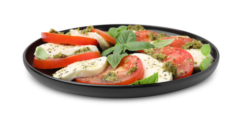 Plate of delicious Caprese salad with pesto sauce isolated on white