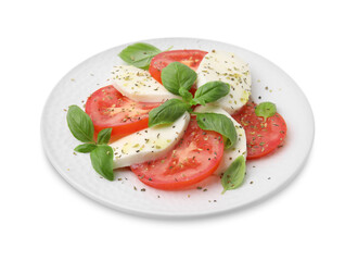 Plate of delicious Caprese salad with herbs isolated on white