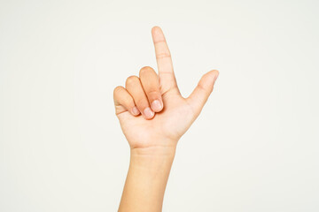 child hand pointing with two fingers, hand showing peace sign isolated on white background