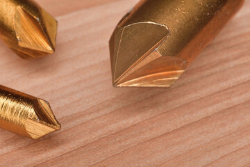 Countersink drill bit woodworking tool. Closeup of hole chamfer 5 flutes drill bit.