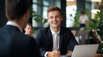 Naklejka na ściany i meble Smiling young male bank manager listening at team work office meeting or job interview sitting at table. generative AI