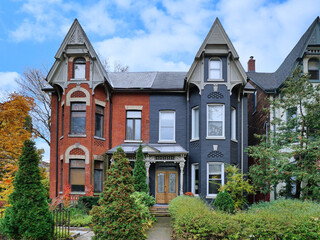 Old narrow Victorian semi-detached houses with gables