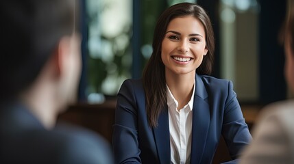Smiling young female bank manager listening at team work office meeting or job interview sitting at table. generative AI