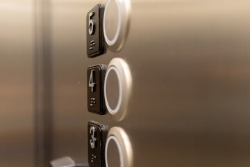 Elevator buttons - close-up of 3, 4, and 5