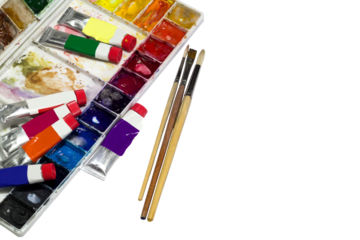 Close-up view of watercolor tubes with brushes and unclean palette isolated on transparent background png file.
