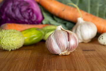 Various vegetables from the market on a wooden board. Food of organic and plant origin.