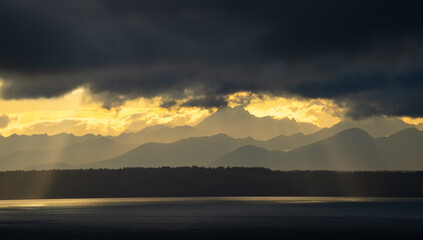 Sunlight Over Kitsap[ Peninsula and Olympic Mountains on a cloudy day