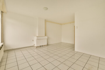 an empty room with white walls and tile flooring on the floor, there is no one person in it