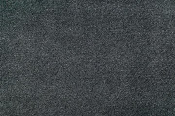 The background is made of black denim material.