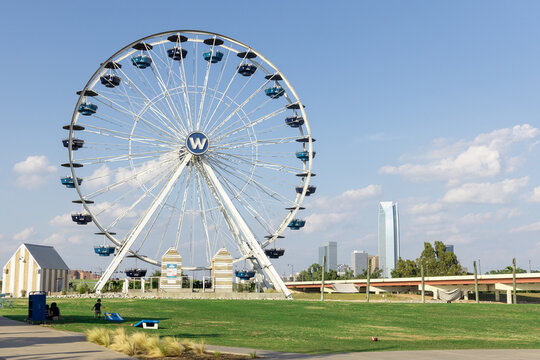 Oklahoma City, USA - October 25th, 2023: Ferris wheel and sign placed near downtown Oklahoma City.
