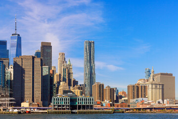 Fototapeta na wymiar On sunny day Lower Manhattans panoramic skyline offers stunning view of cityscape NYC