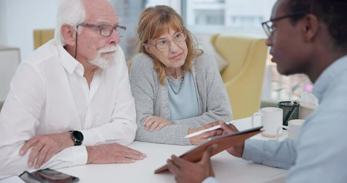 Senior Couple With A Male Financial Advisor By A Table In The Dining Room Of Their Modern House. Conversation, Meeting And Elderly Man And Woman Planning Their Retirement Fund With Accountant At Home