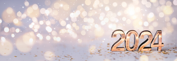 Golden digits 2024 on bokeh lights background