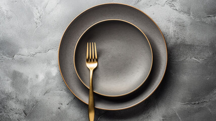plate and serving of cutlery on a gray background grunge style. - obrazy, fototapety, plakaty