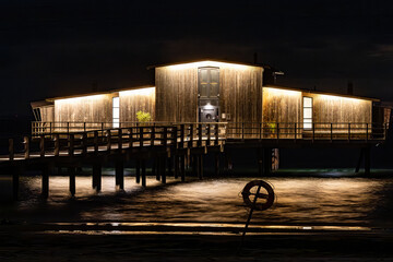 Bastad, Sweden The landmark Kallbadhus or Cold Water Bathhouse on the  downtown beach at night.