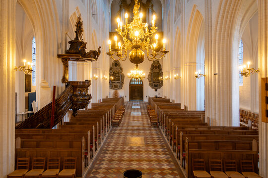 Odense, Denmark The nave and pews inside the St. Canute's Cathedral, Sankt Knuds Kirke.