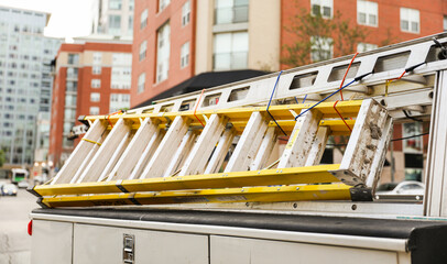 construction ladder against blue sky, symbolizing progress, opportunity, and upward mobility in the building industry
