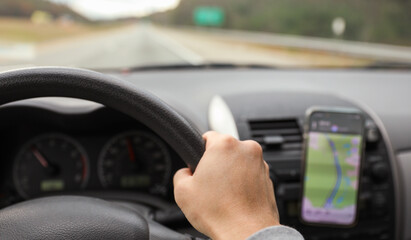 hands gripping a steering wheel, symbolizing control, focus, and safety while driving