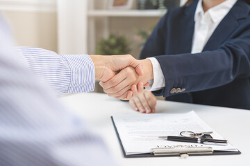Sell agent, success deal asian young woman handshake or shaking hands with landlord realtor, client male after buyer man signed rental, lease contract. Banker agreement mortgage loan, property lease.