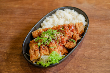 Chicken Katsu Curry is a dish of crispy chicken pieces served over rice with Japanese curry sauce.