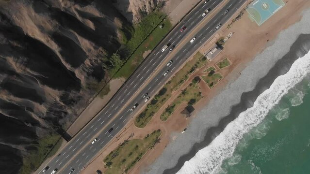 Aerial view with a drone of the green coast highway in Miraflores, Lima, Peru