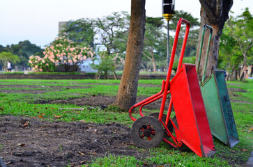 Fototapeta premium Garden wheelbarrows are parked . These handcart are been ready for farm gardening because they are a tool for carriage a cargoes.