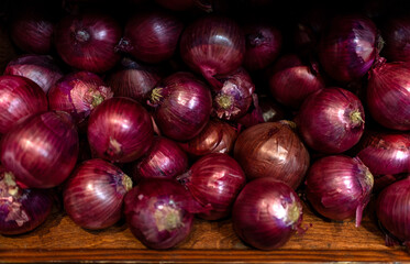 red onions on a wooden background