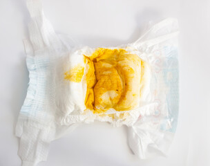 Baby Health Concept: Dirty stinky diaper with yellow poop of newborn baby - obrazy, fototapety, plakaty