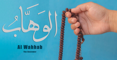 Hand of Muslim woman holding prayer beads, 99 Names of God, Muslim woman praying Name Of Allah Al Wahhab