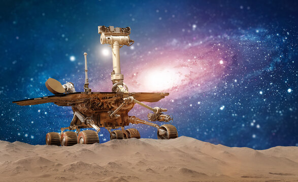 Mars rover on martian surface with deep space. Galaxy and stars. Robot in space. Elements of this image furnished by NASA