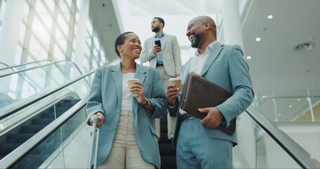 Happy business people, coffee and laughing on escalator for funny joke, discussion or morning at airport. Businessman and woman smile with latte or cappuccino down a moving staircase for work travel - obrazy, fototapety, plakaty