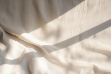 Beige satin fabric texture background with sunlight and shadow from window. High quality photo - obrazy, fototapety, plakaty