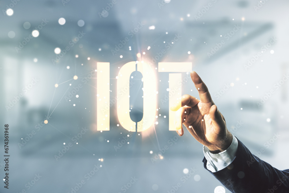 Poster man hand working with abstract virtual iot hologram on blurred office background, internet of things