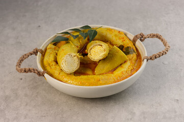 Gulai Tambusu is Padang's Popular Dish made from Cow Intestine Filled with Tofu in Coconut Milk Curry Soup.