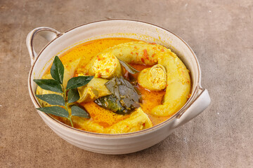 Gulai Tambusu is Padang's Popular Dish made from Cow Intestine Filled with Tofu in Coconut Milk Curry Soup.