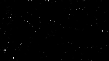 White Snow on a black background. Falling snow isolated on a black background.