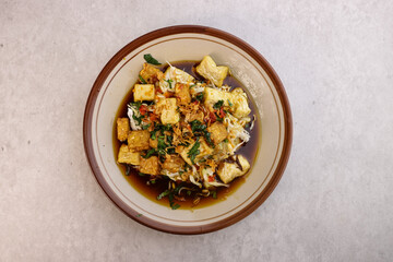 Tahu Guling is Yogyakarta Culinery Food Made From Fried Tofu and Tempeh with Bean Sprouts and Cabbage in Sour Clear Sauce.