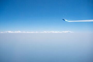 airplane flying over the clouds