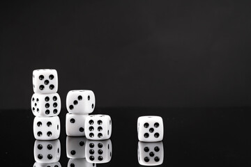 White dice on black background studio shot