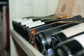 bottles of wine on the shelf. Wine cellar. Wine library.